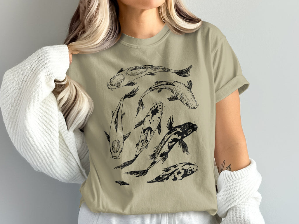 Tan t-shirt with a black sketch of five koi fish swimming.