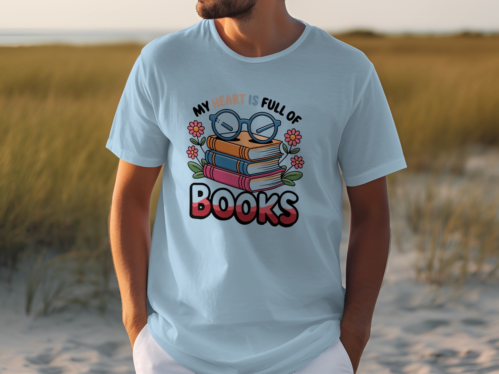 Light blue t-shirt with "My Heart Is Full Of Books" text and stacked books design.
