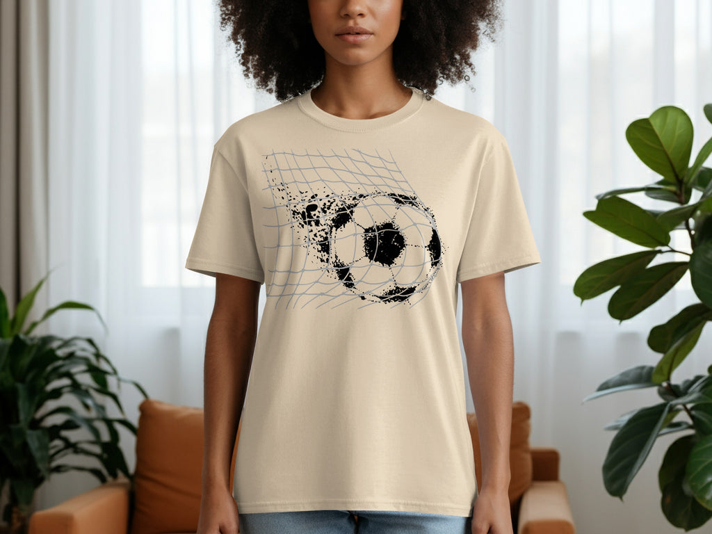 Cream t-shirt with black graphic of a soccer ball breaking through a net.