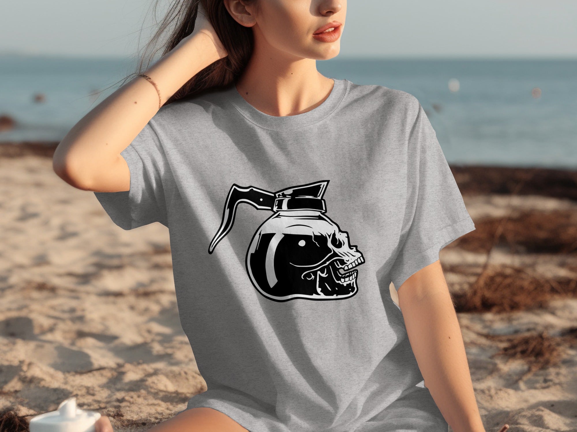 T-shirt with a black and white skull-shaped coffee pot graphic on a gray shirt.
