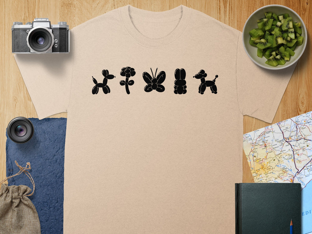 Light beige t-shirt with black balloon animals: dog, flower, butterfly, rabbit, poodle.