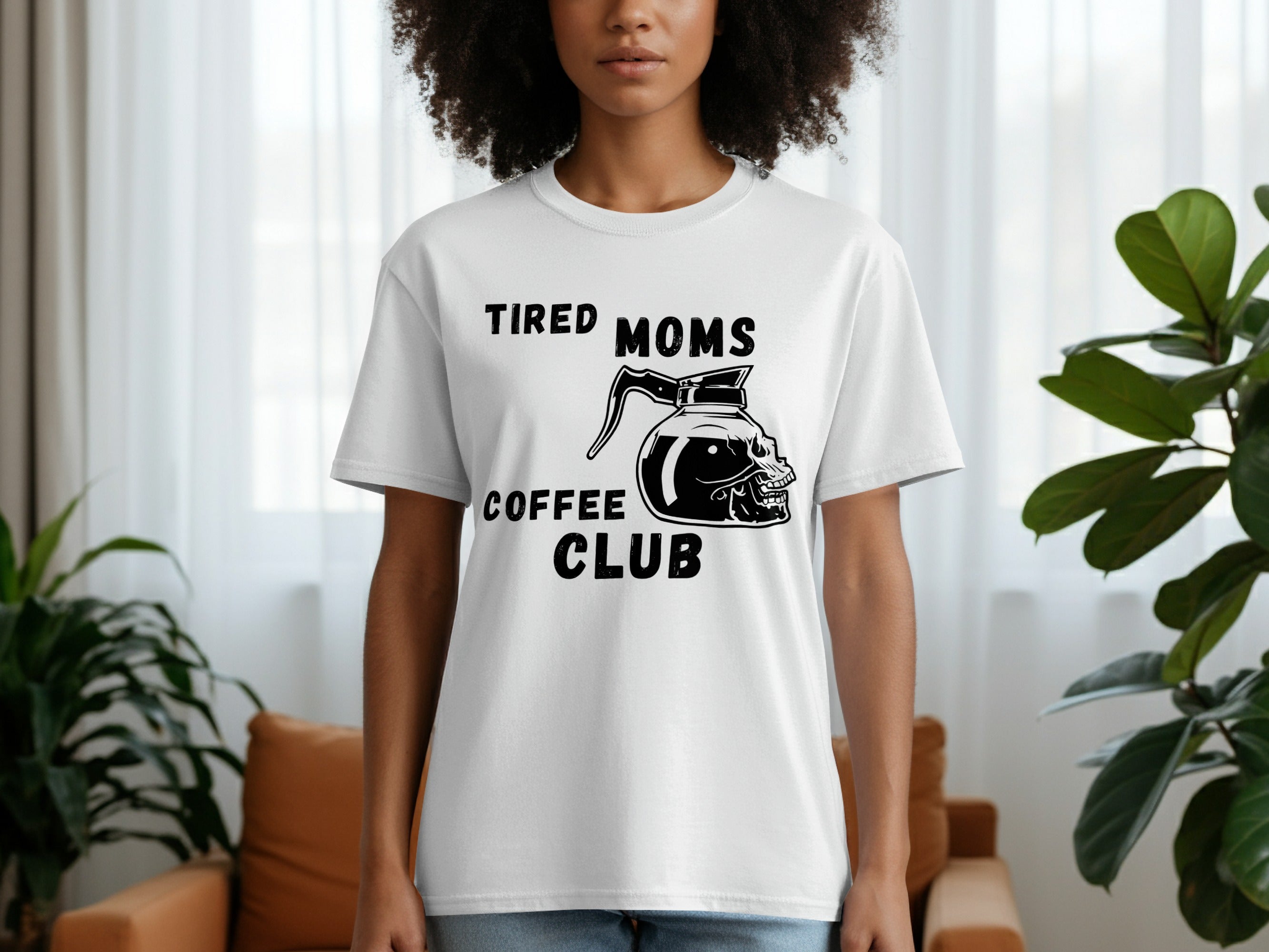 White t-shirt with "Tired Moms Coffee Club" text and skull coffee pot graphic.