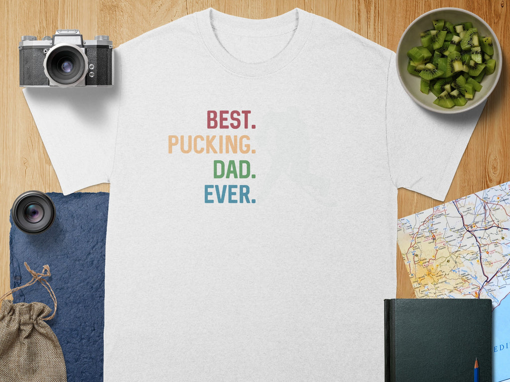 White t-shirt with "BEST. PUCKING. DAD. EVER." text in colorful block letters.