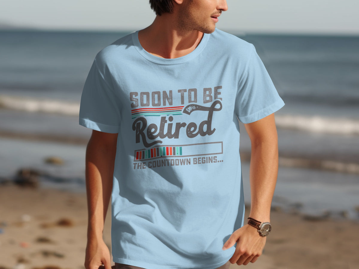 Light blue t-shirt with "Soon to be Retired" and countdown graphic.