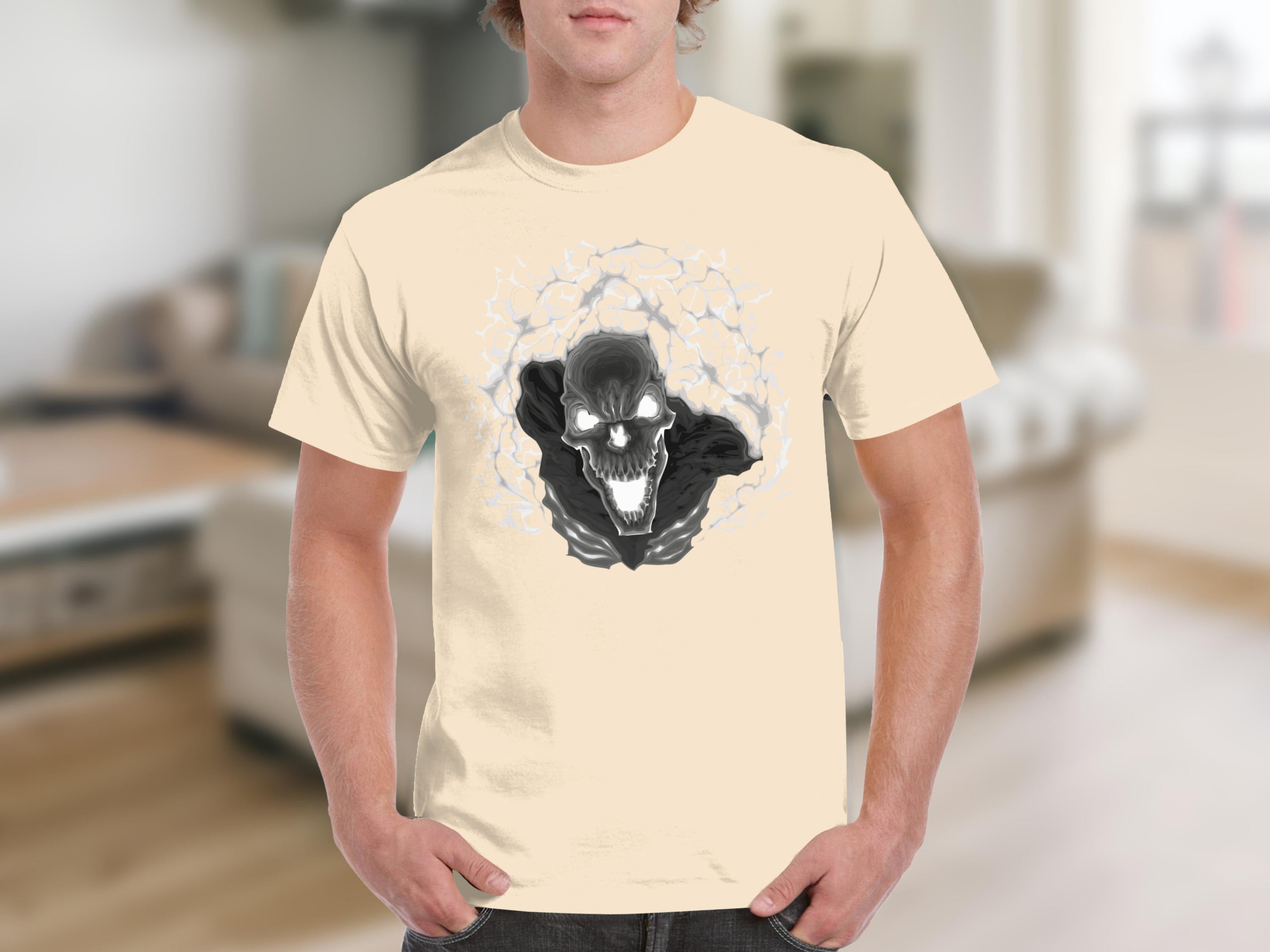 Cream t-shirt with a black and white skull graphic with glowing eyes surrounded by smoke.