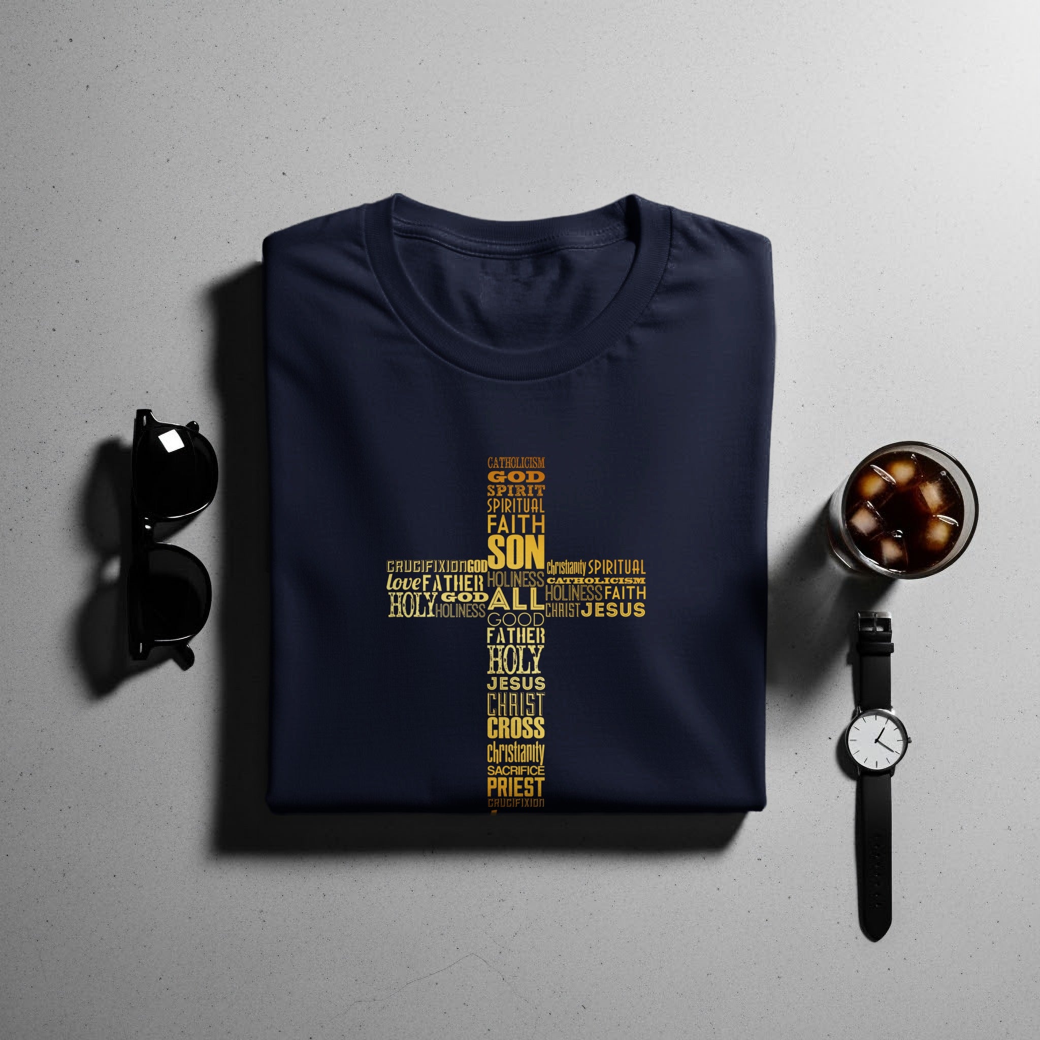 Navy t-shirt with gold religious text forming a cross design.