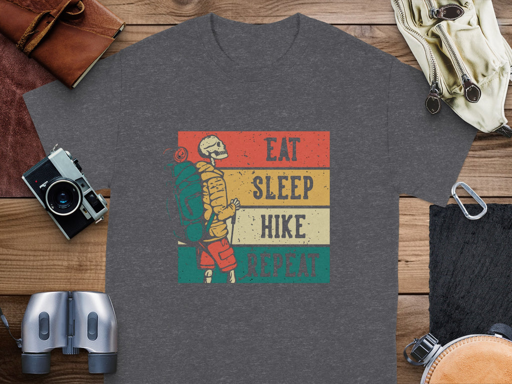 Skeleton hiker graphic with text Eat Sleep Hike Repeat on a t-shirt.