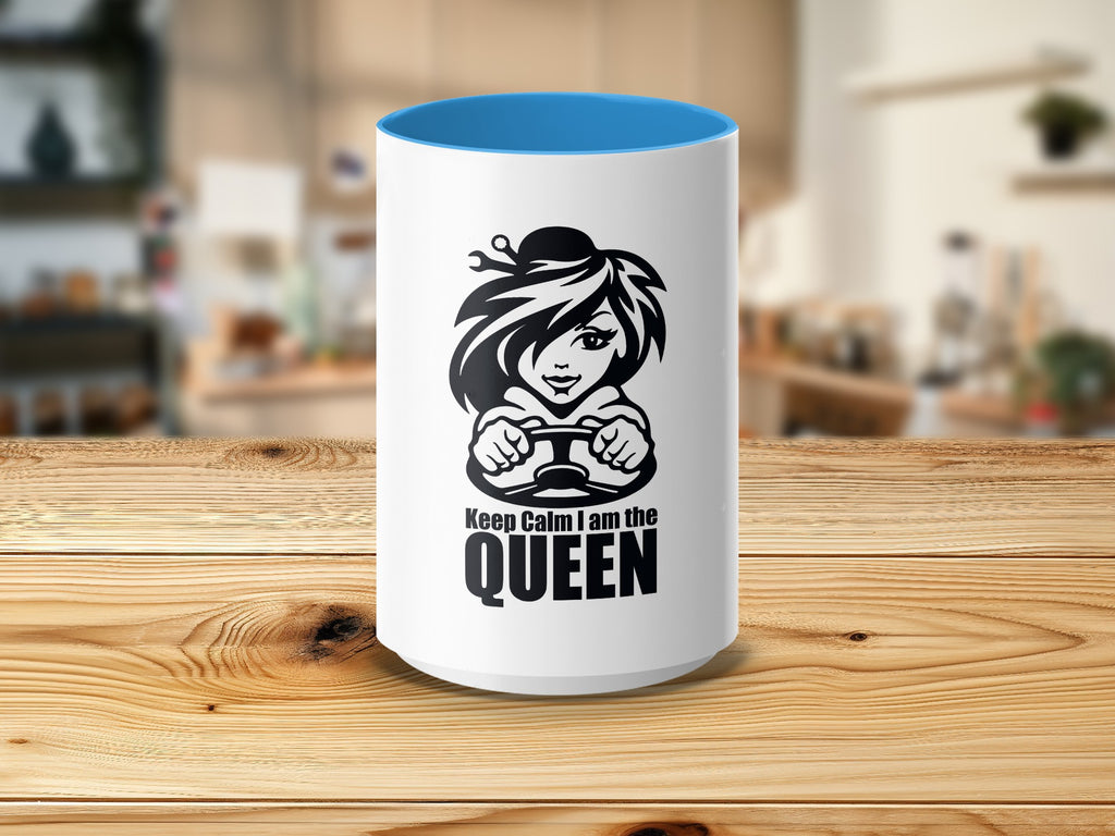 White mug with blue interior featuring black graphic of woman driving and text "Keep Calm I am the QUEEN".