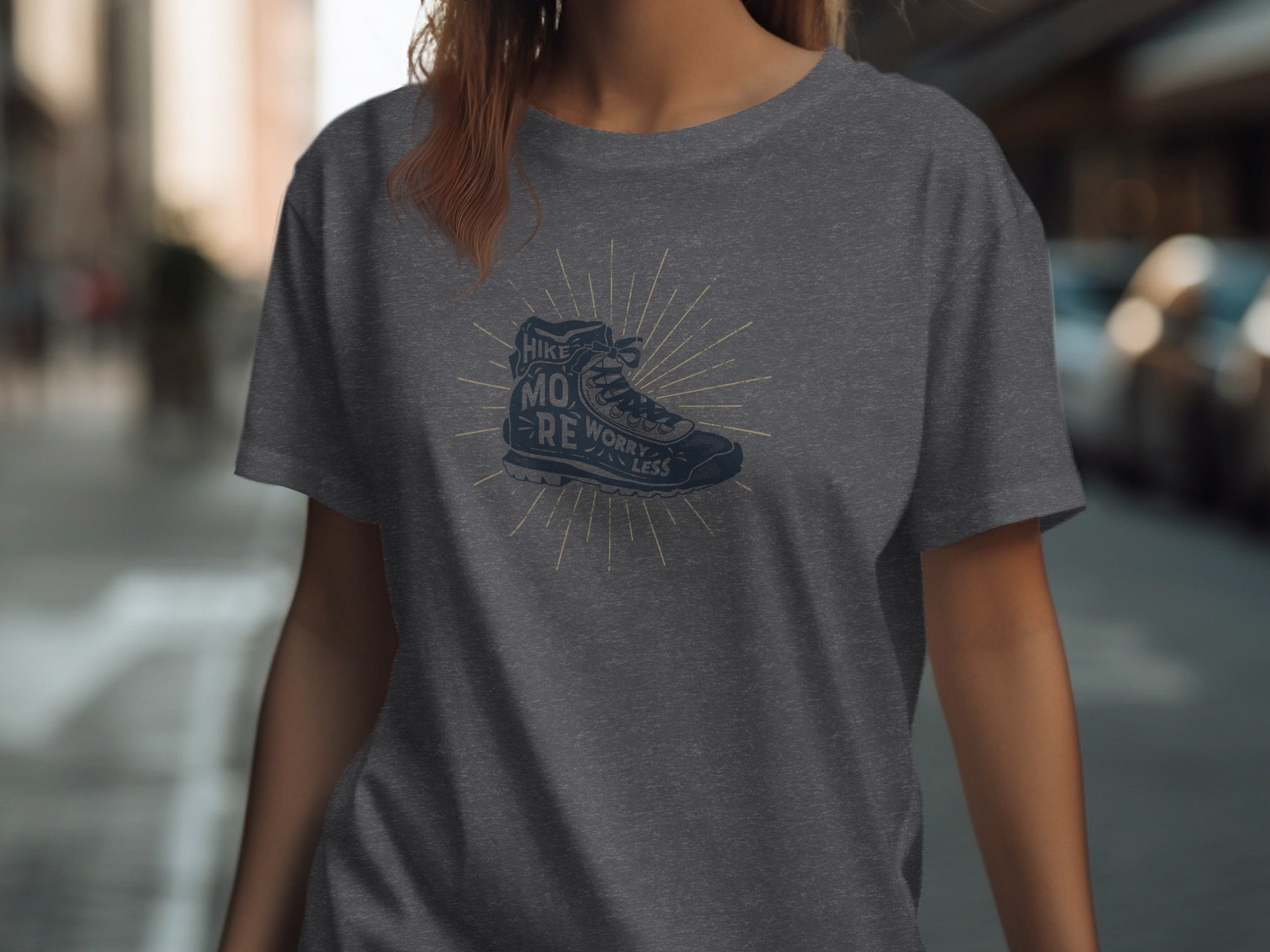 Dark grey t-shirt with a dark blue hiking boot graphic and text.
