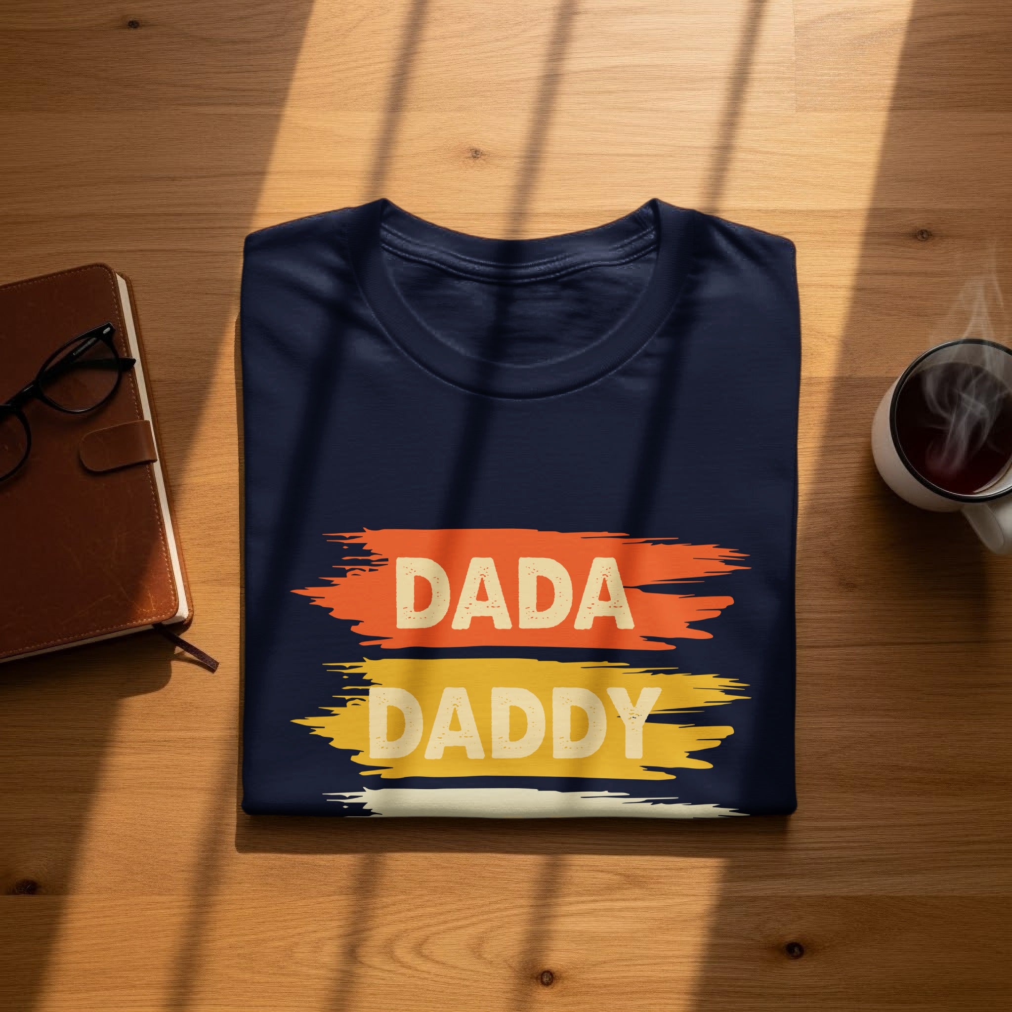 Navy t-shirt with "DADA" and "DADDY" text in distressed yellow and orange.