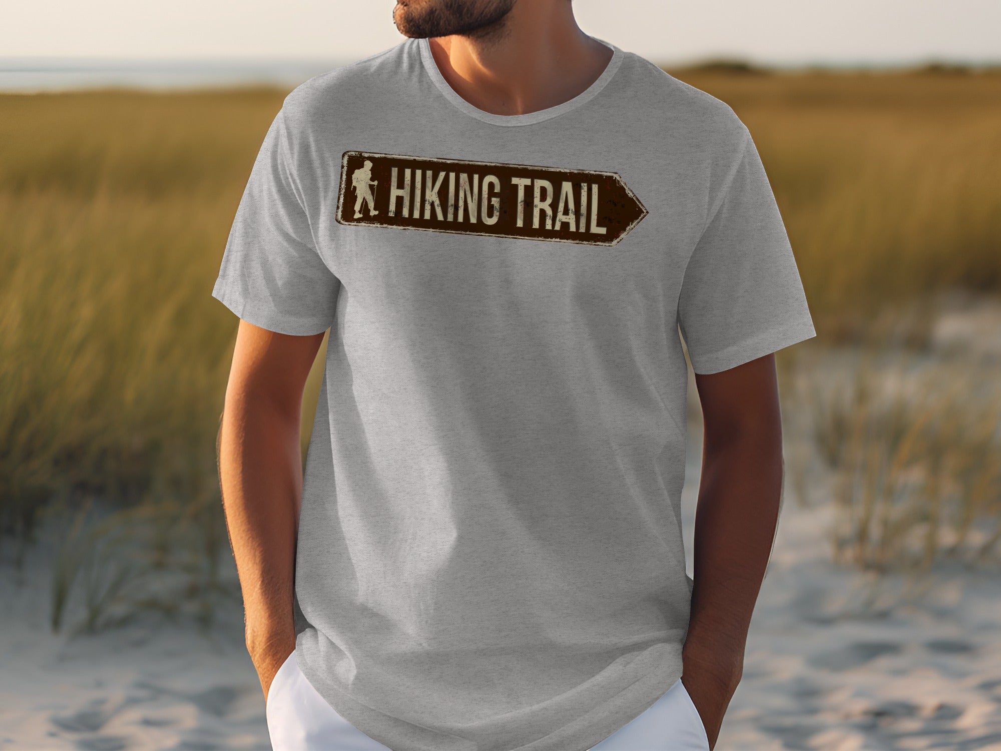 Light gray t-shirt with brown "Hiking Trail" sign graphic pointing right.