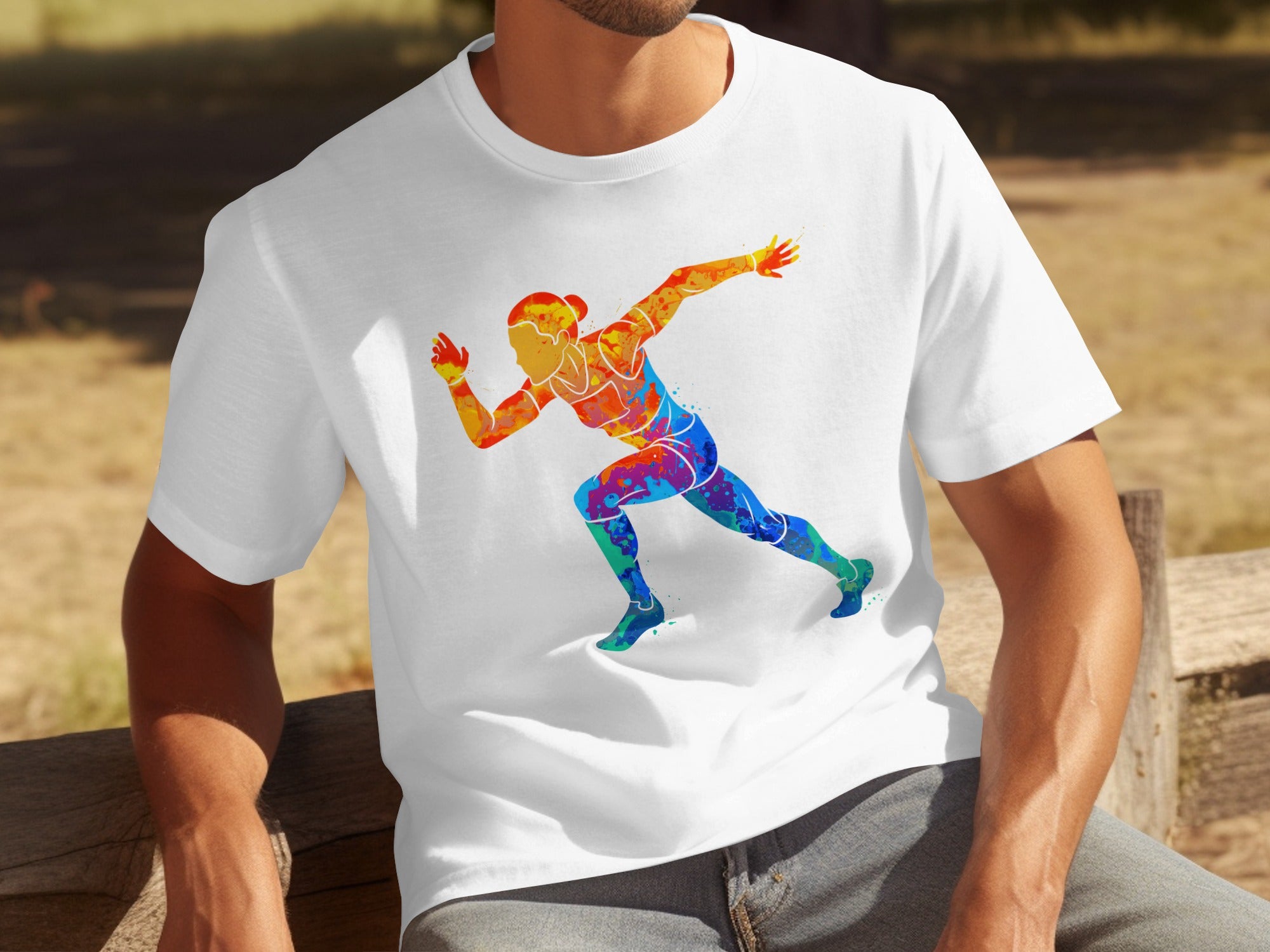 White t-shirt with a colorful watercolor graphic of a running figure.