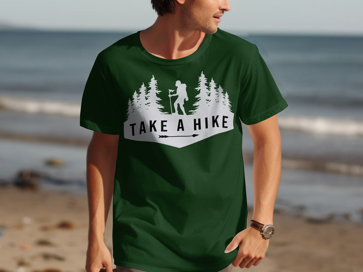 Dark green t-shirt with white "Take A Hike" graphic featuring a hiker and trees.