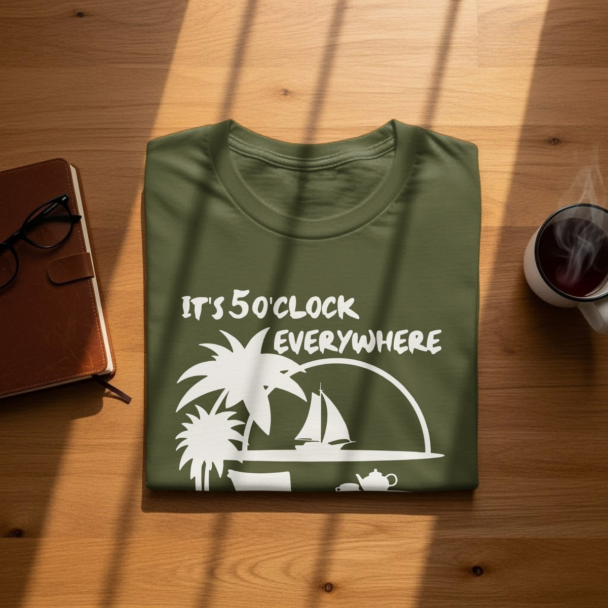 Green t-shirt with "It's 5 O'clock Everywhere" text and tropical scene graphic.