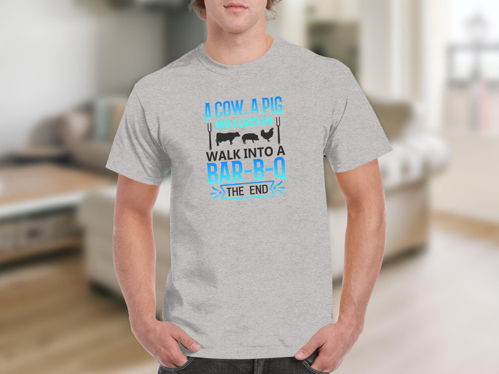 Gray t-shirt with text "A cow, a pig and a chicken walk into a bar-b-q the end"