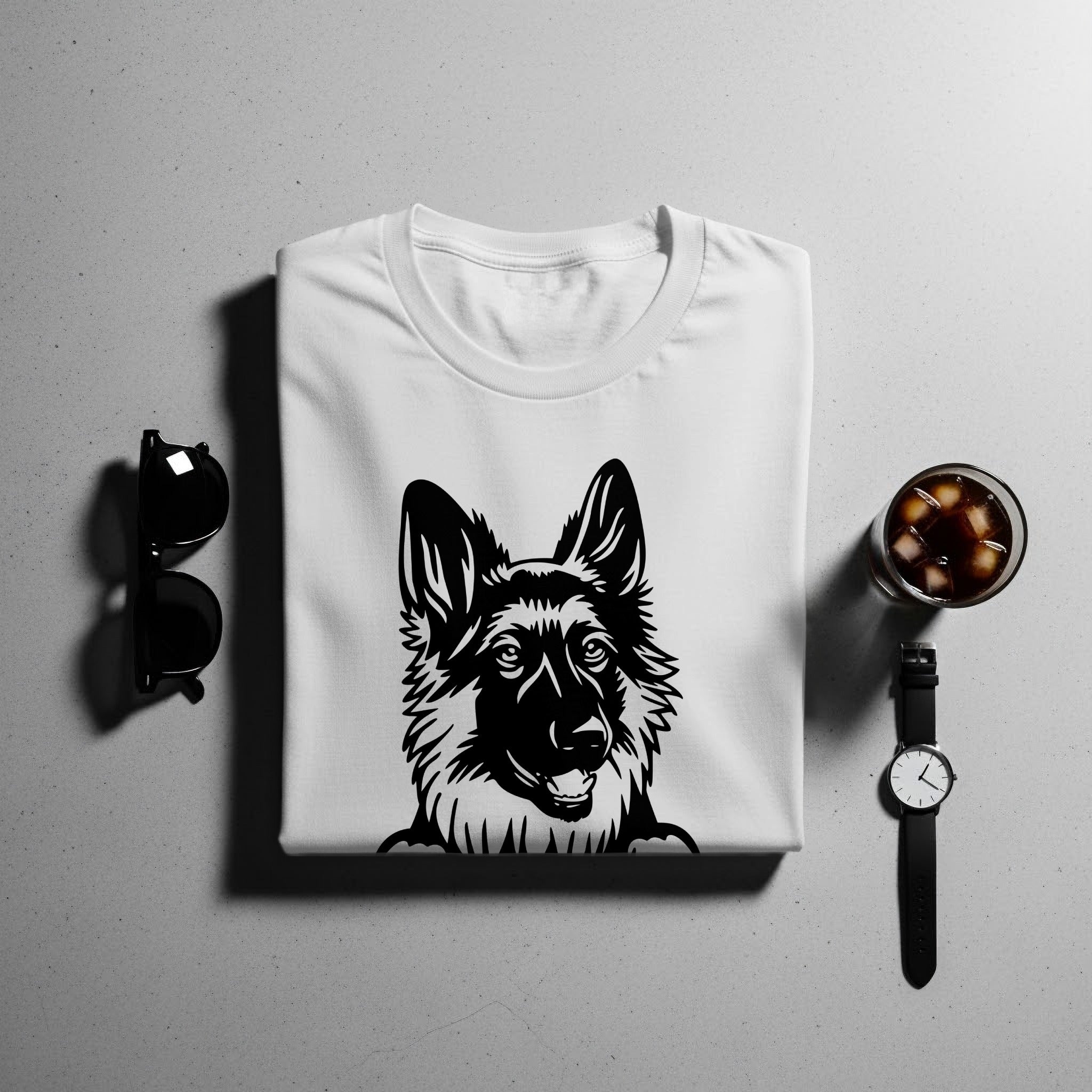 White t-shirt with black German Shepherd graphic, sunglasses, glass of iced drink, and watch.