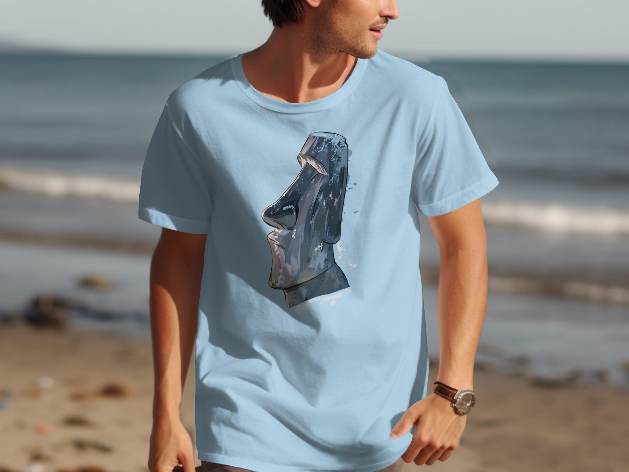 Light blue t-shirt with a grey Moai statue graphic.