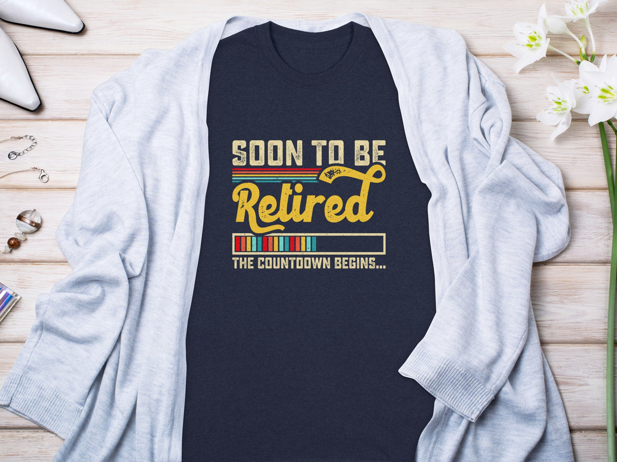 Dark blue t-shirt with "Soon to be Retired" text and countdown bar graphic.