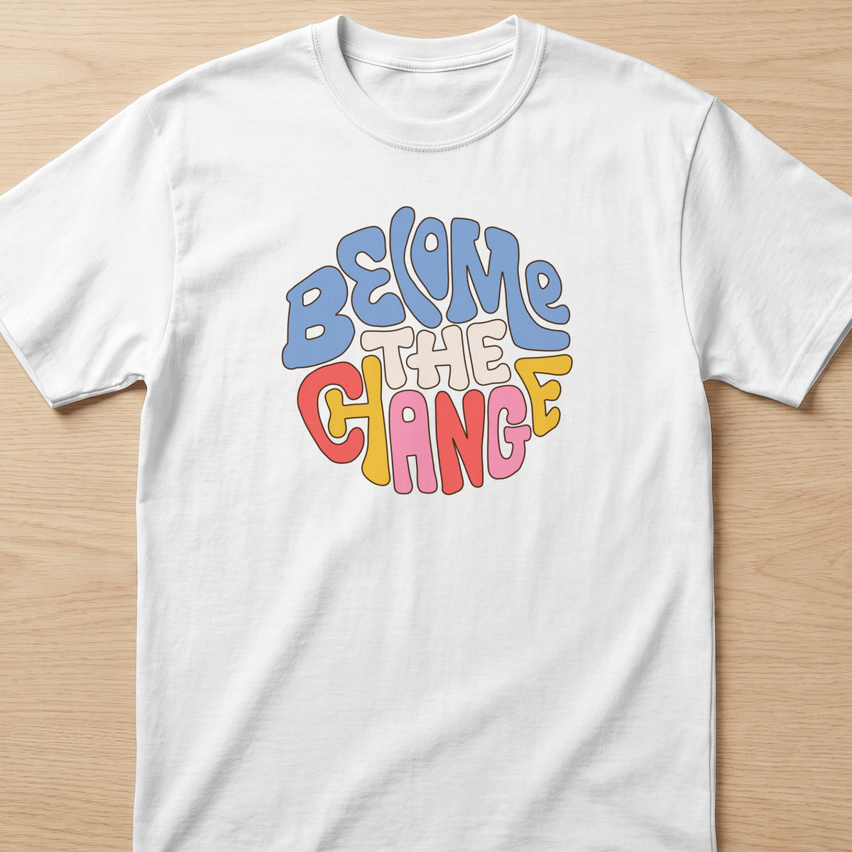 White t-shirt with "Become the Change" text in a retro, colorful font.