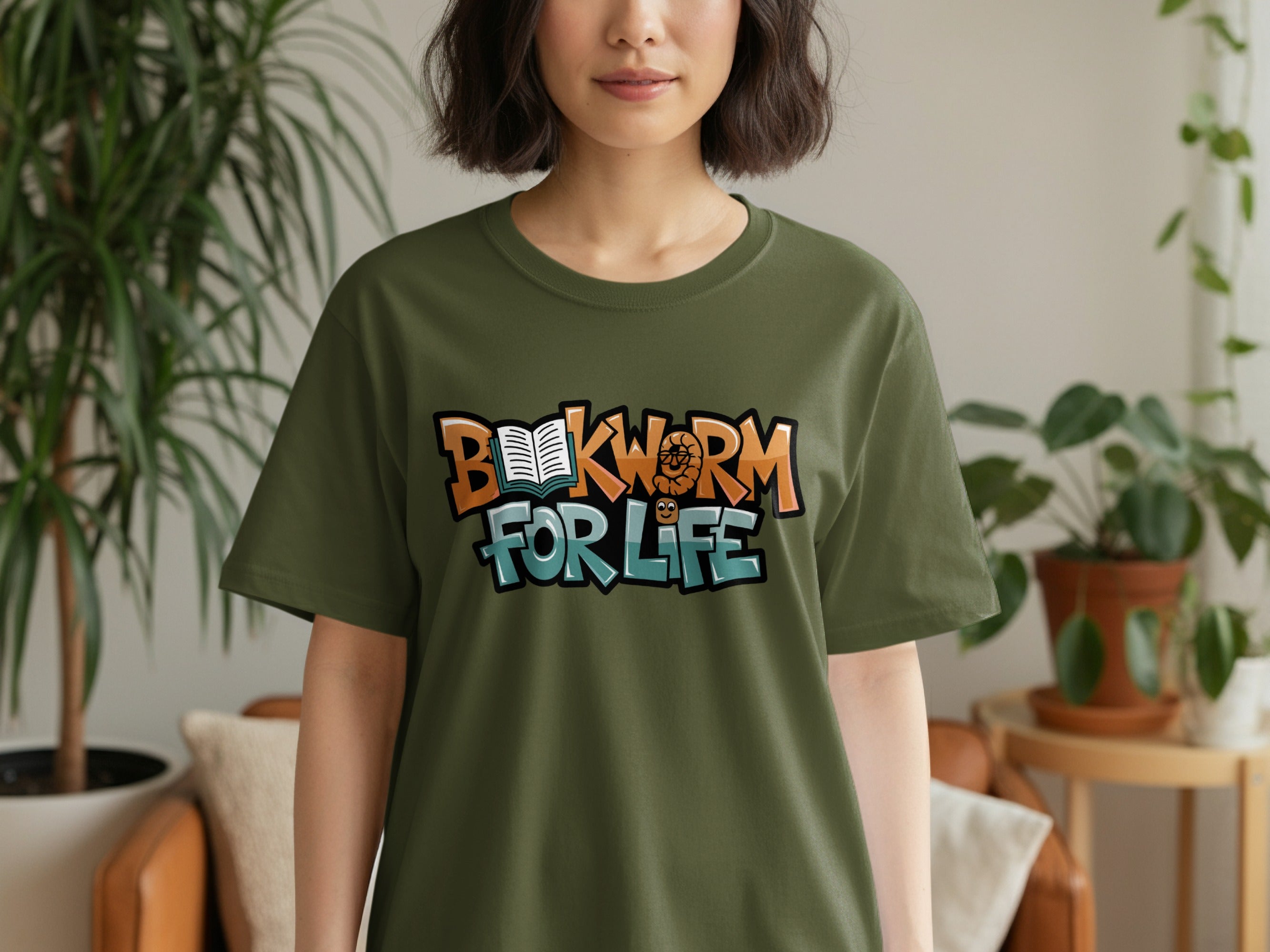 Olive green t-shirt with "Bookworm for Life" text and cartoon worm graphic.