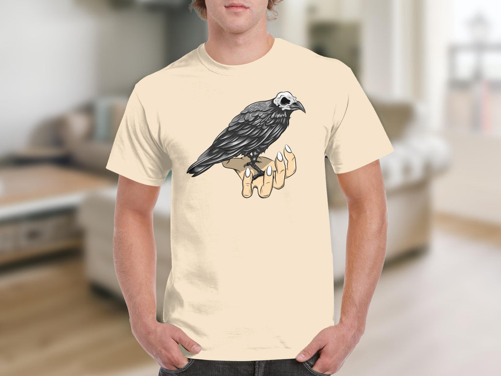 Graphic of a raven with a skull head perched on a human hand.