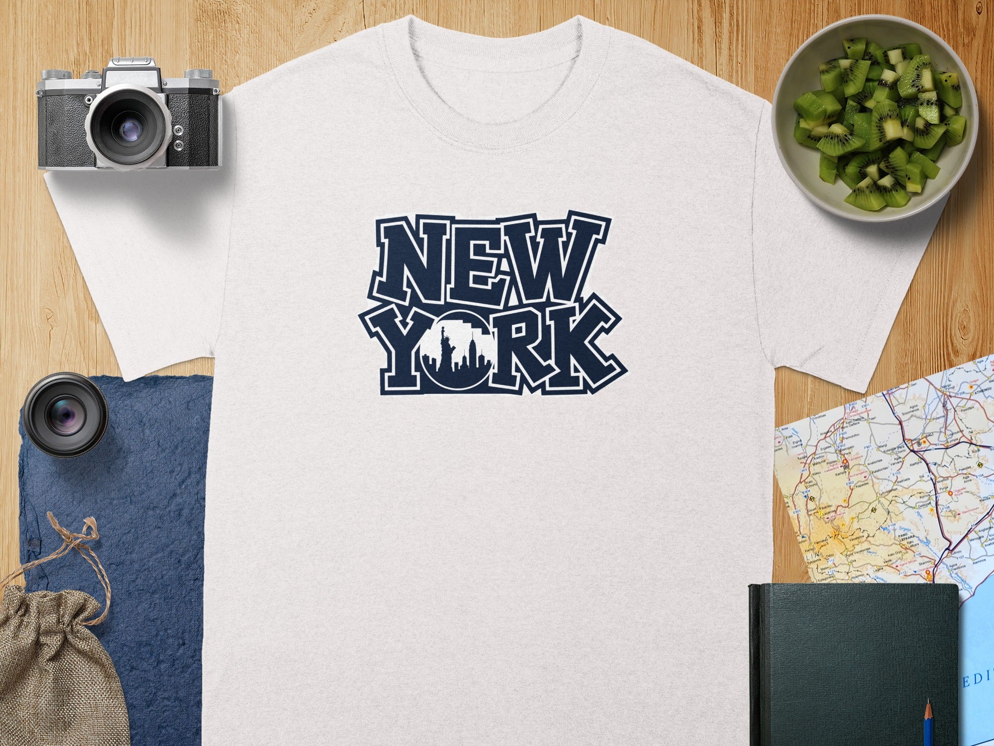 White t-shirt with "NEW YORK" text and skyline graphic.