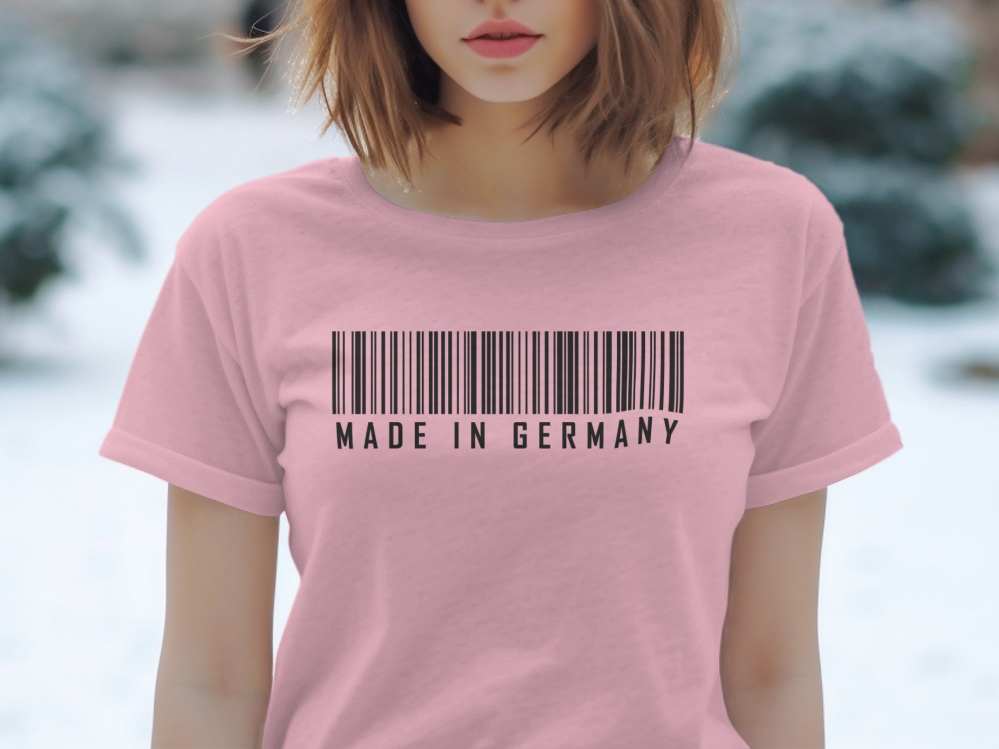 Pink t-shirt with a barcode and "Made in Germany" text graphic.