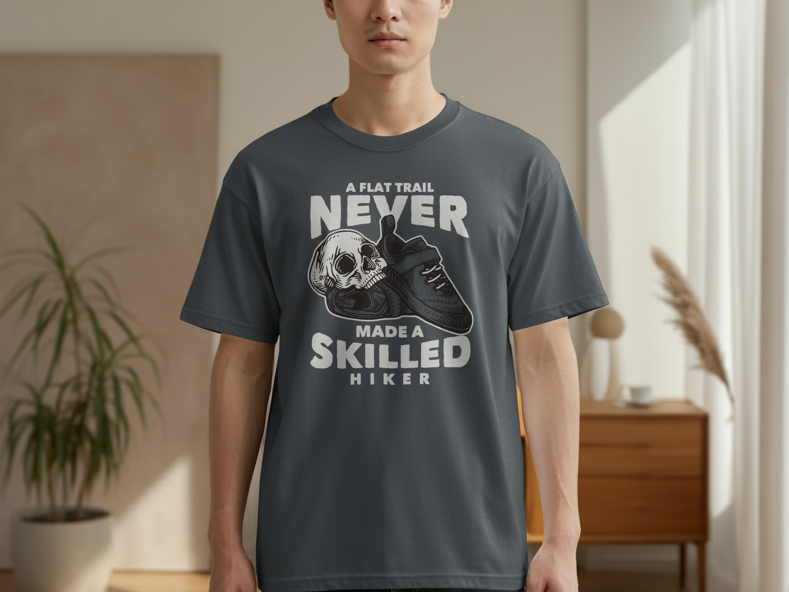 Skull and hiking boot graphic with text "A Flat Trail Never Made a Skilled Hiker."