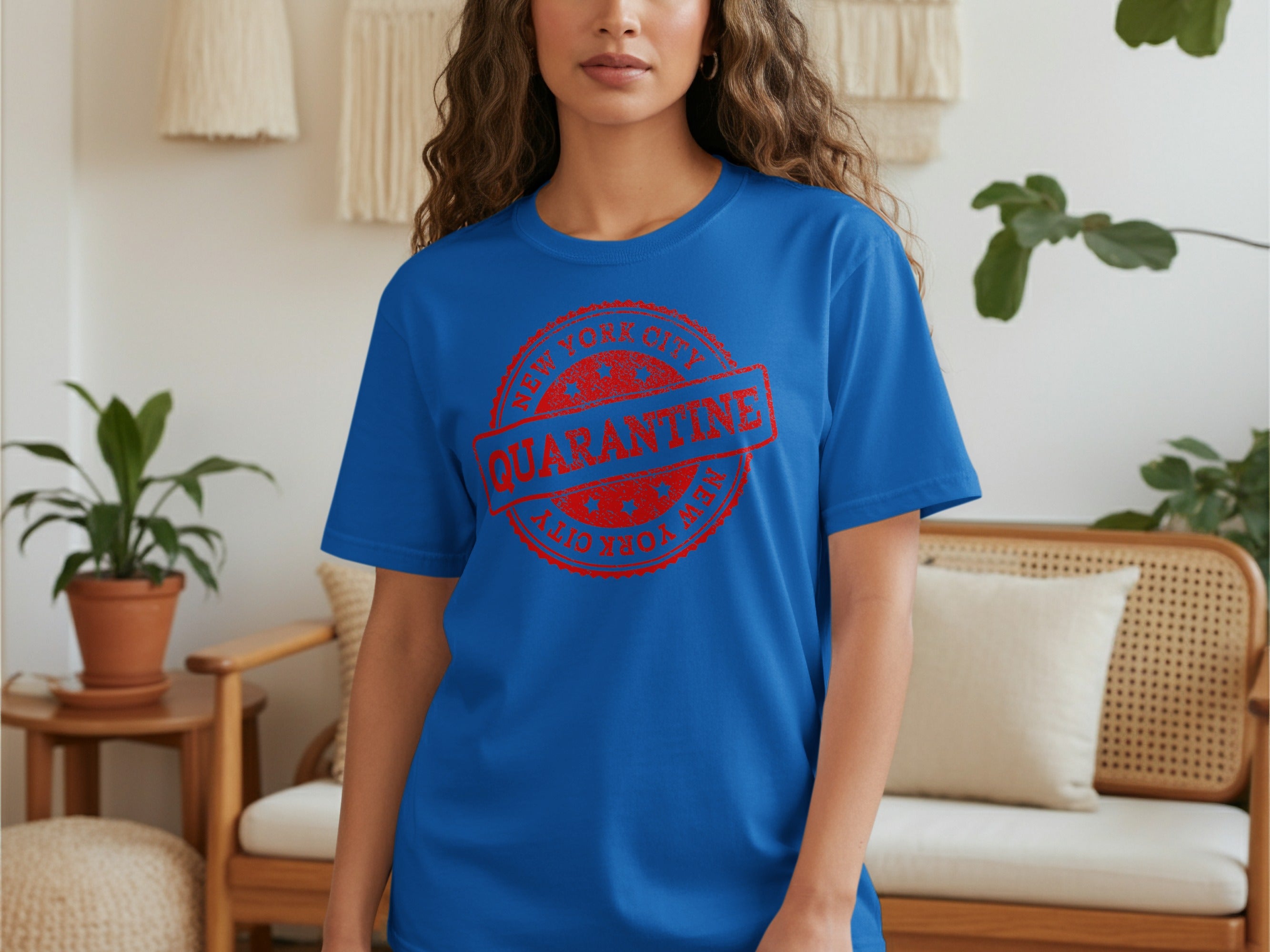 Blue t-shirt with red stamp reading "New York City Quarantine".