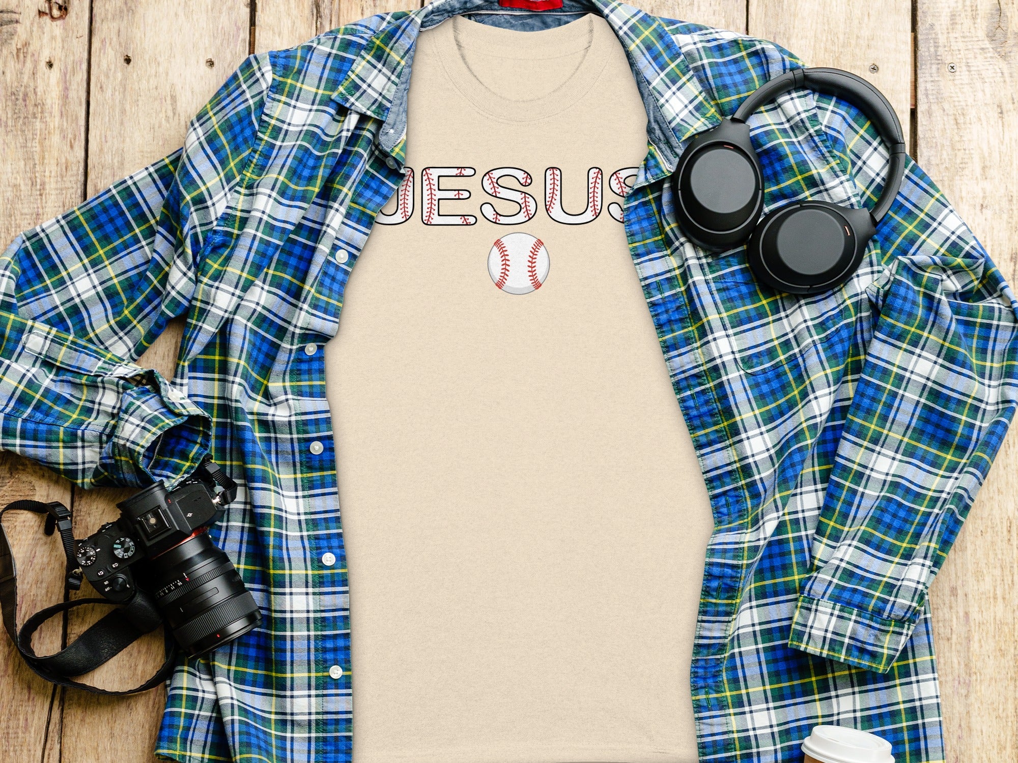 T-shirt with "JESUS" in baseball stitching design and a baseball.