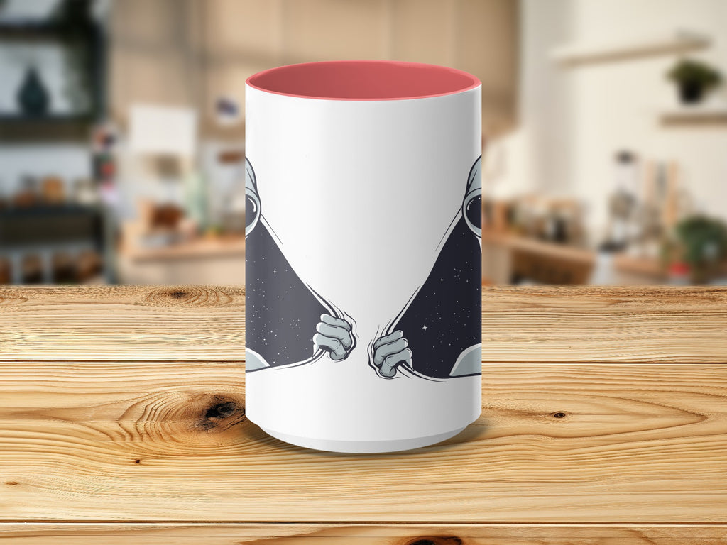 White mug with pink interior features astronauts pulling apart starry space.