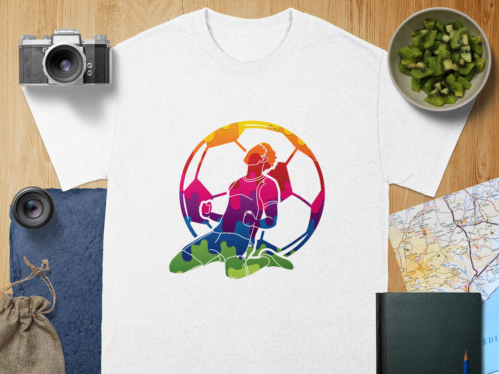 White t-shirt with colorful abstract soccer player graphic.