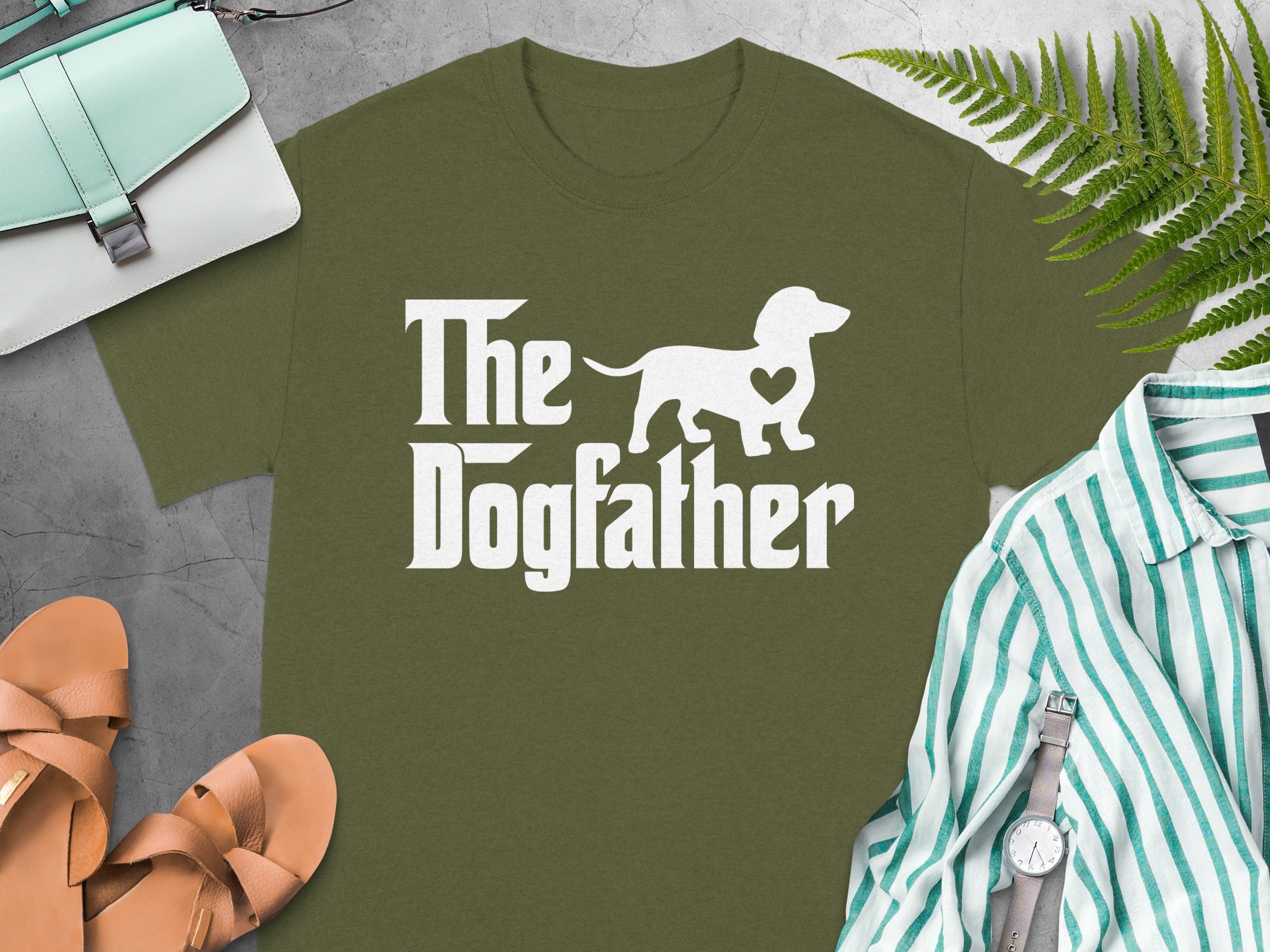 Olive green t-shirt with "The Dogfather" text and a dachshund silhouette.