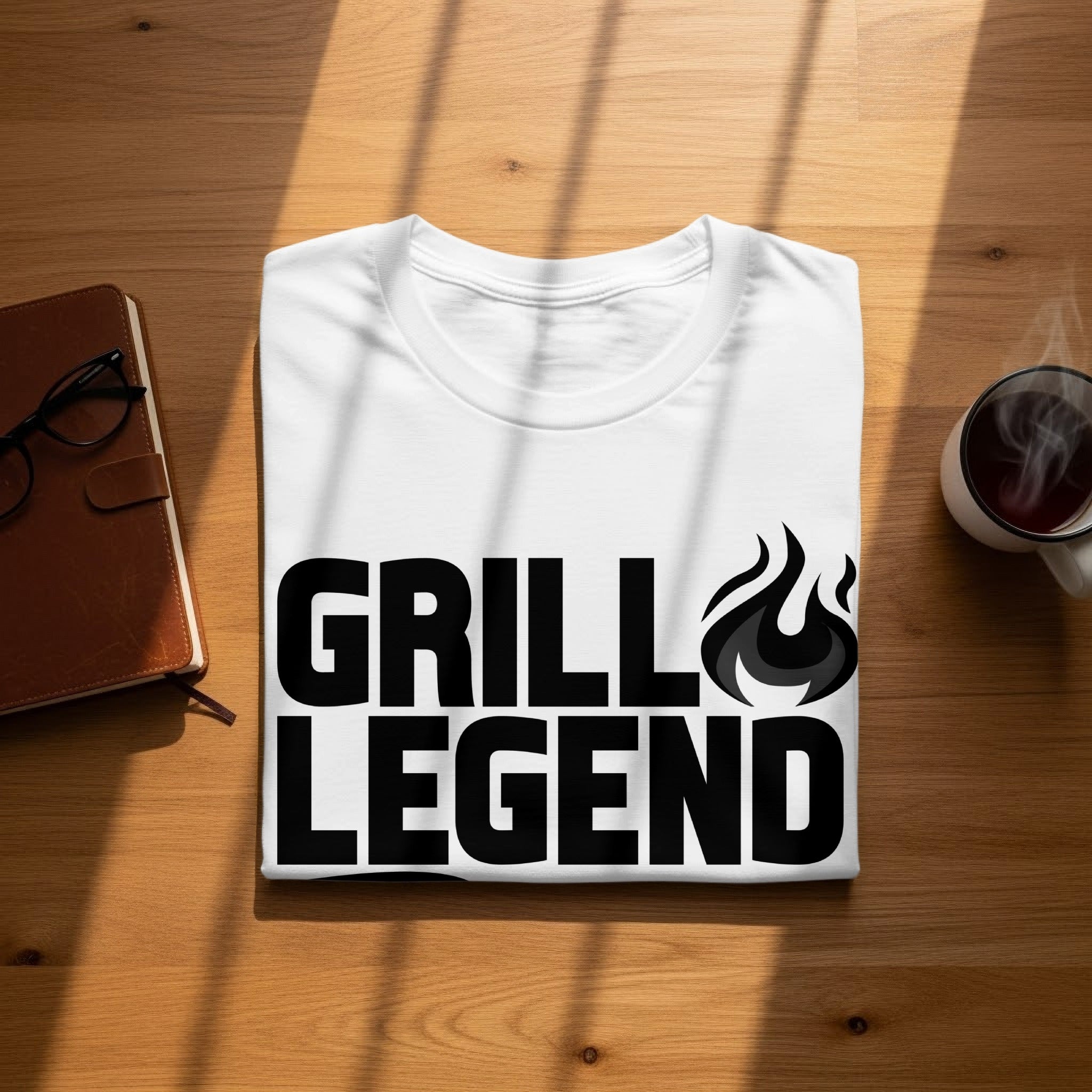 White t-shirt with black text reading "GRILL LEGEND" and flames.