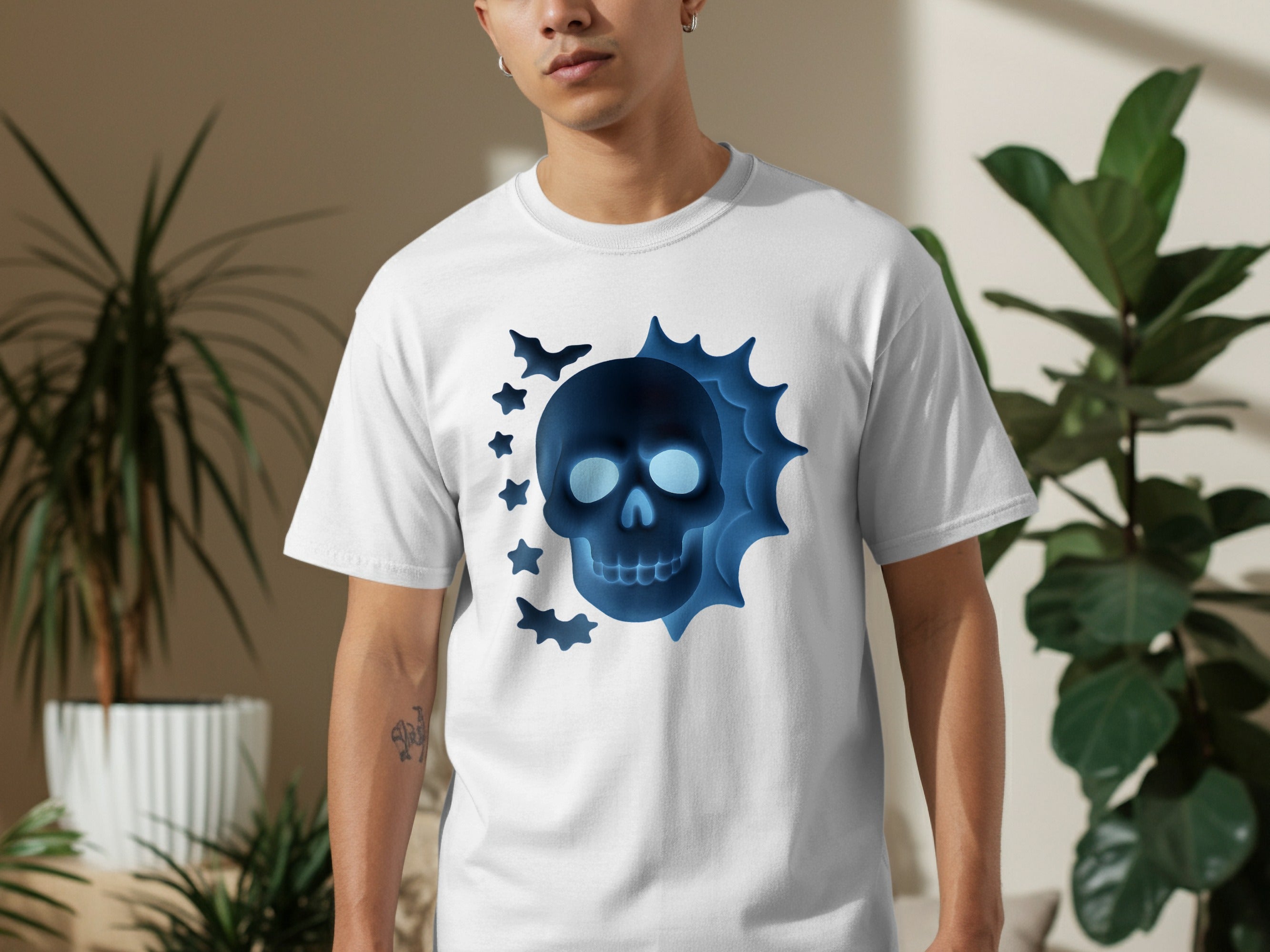 White t-shirt with a neon blue skull graphic and bats.