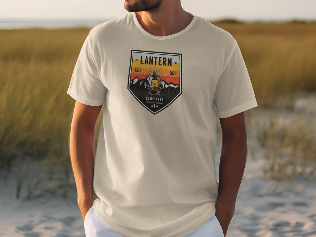 Cream t-shirt with "Lantern Estb 1978 Camp Area" graphic featuring a lantern and mountains.