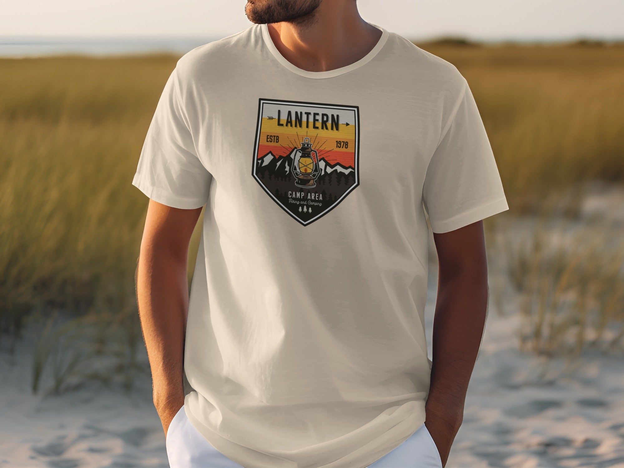 Cream t-shirt with "Lantern Estb 1978 Camp Area" graphic featuring a lantern and mountains.