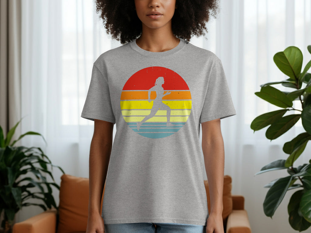 Grey t-shirt with a retro sunset graphic featuring a runner silhouette.