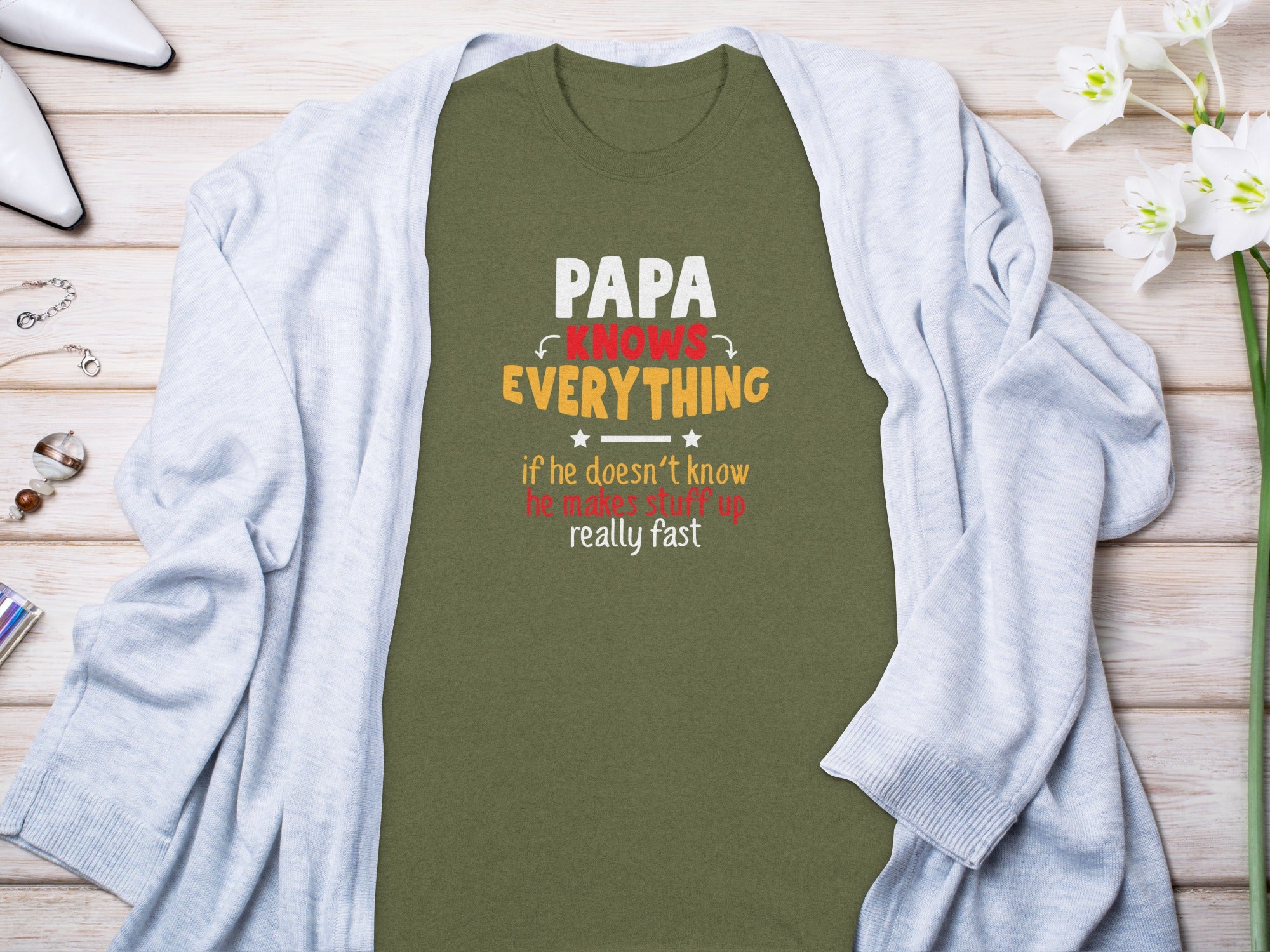 Green t-shirt with text "Papa knows everything if he doesn't know he makes stuff up really fast."