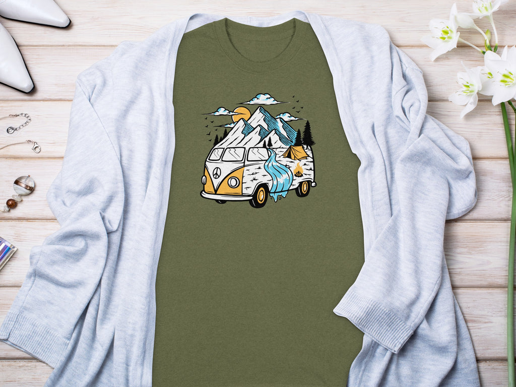 Olive green t-shirt with graphic of camper van, mountains, tent, and campfire.