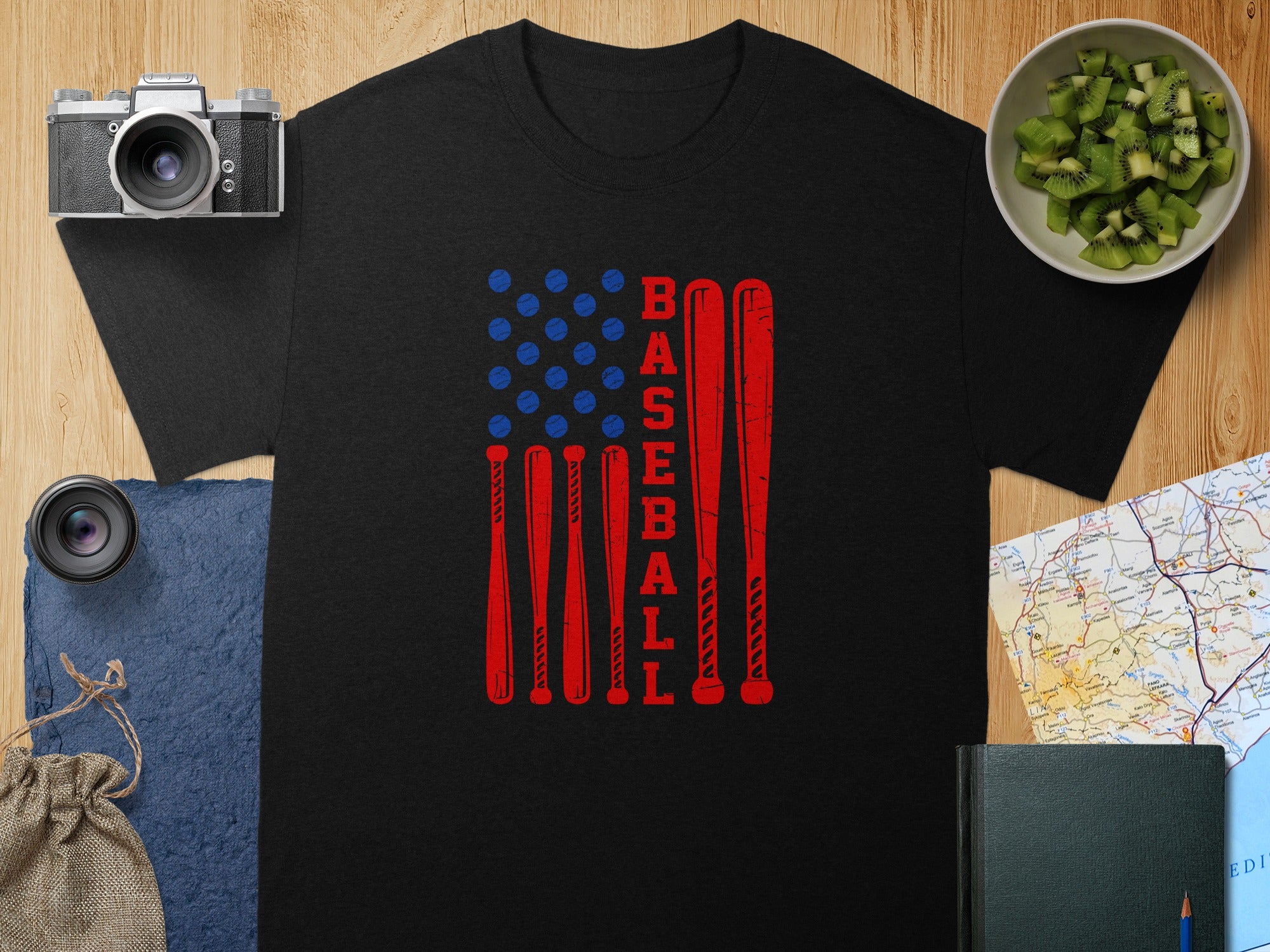 Black t-shirt with American flag design using baseball bats and balls.