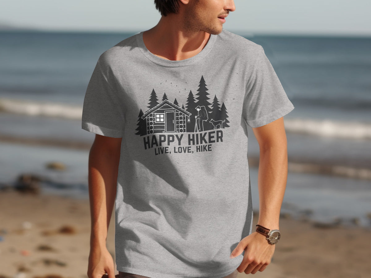 Grey t-shirt with a black graphic of a cabin, trees, hiker, and dog, reading "HAPPY HIKER LIVE, LOVE, HIKE".
