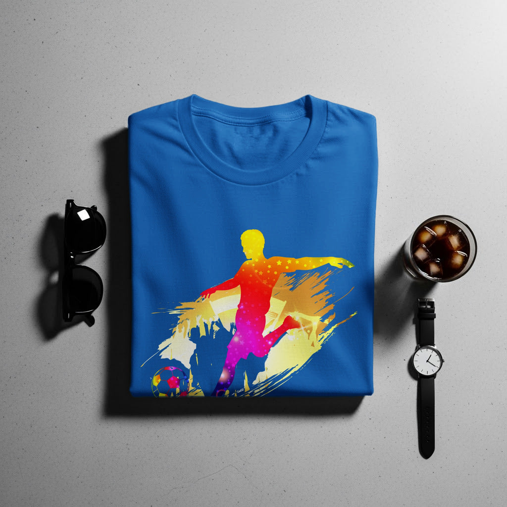 Blue t-shirt with a colorful soccer player silhouette graphic and soccer ball.