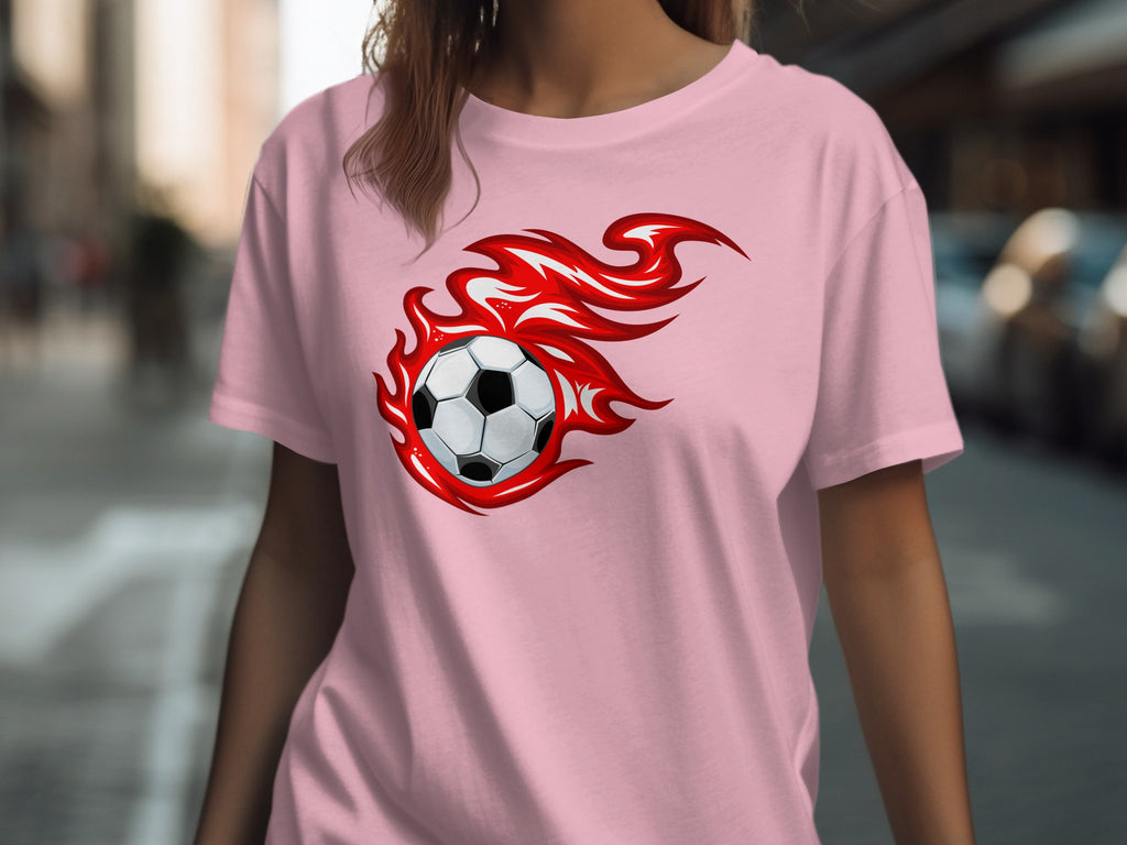 Pink t-shirt with a soccer ball surrounded by red flames graphic.