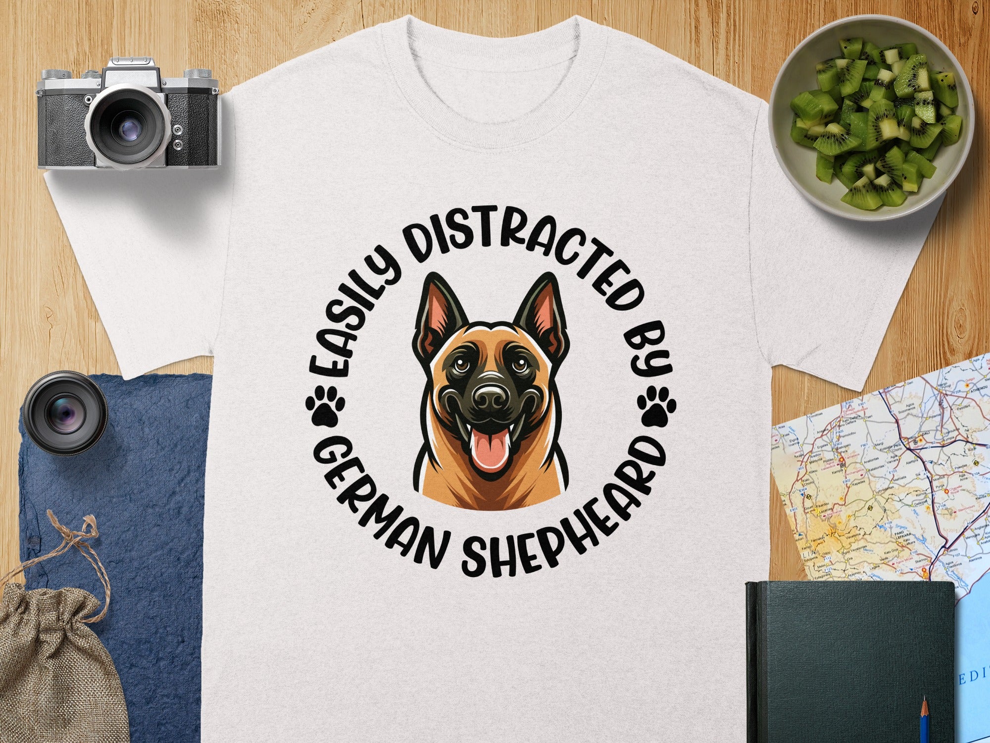 White t-shirt with "Easily Distracted By German Shepherd" text and dog graphic.