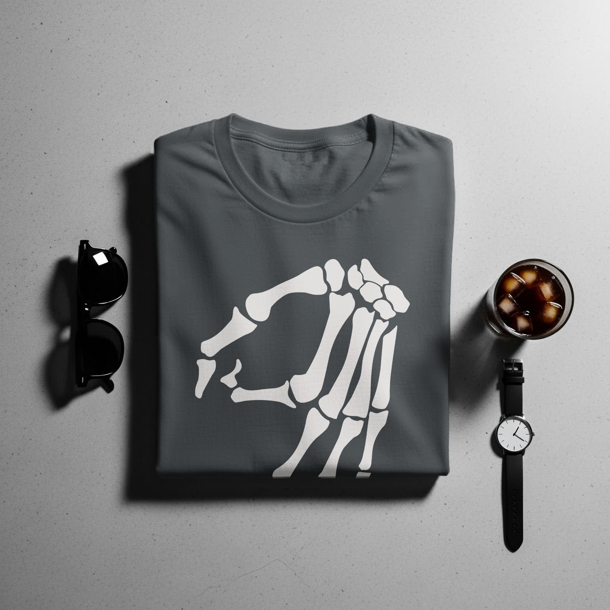 Dark gray t-shirt with a white skeleton hand graphic, sunglasses, and a drink.