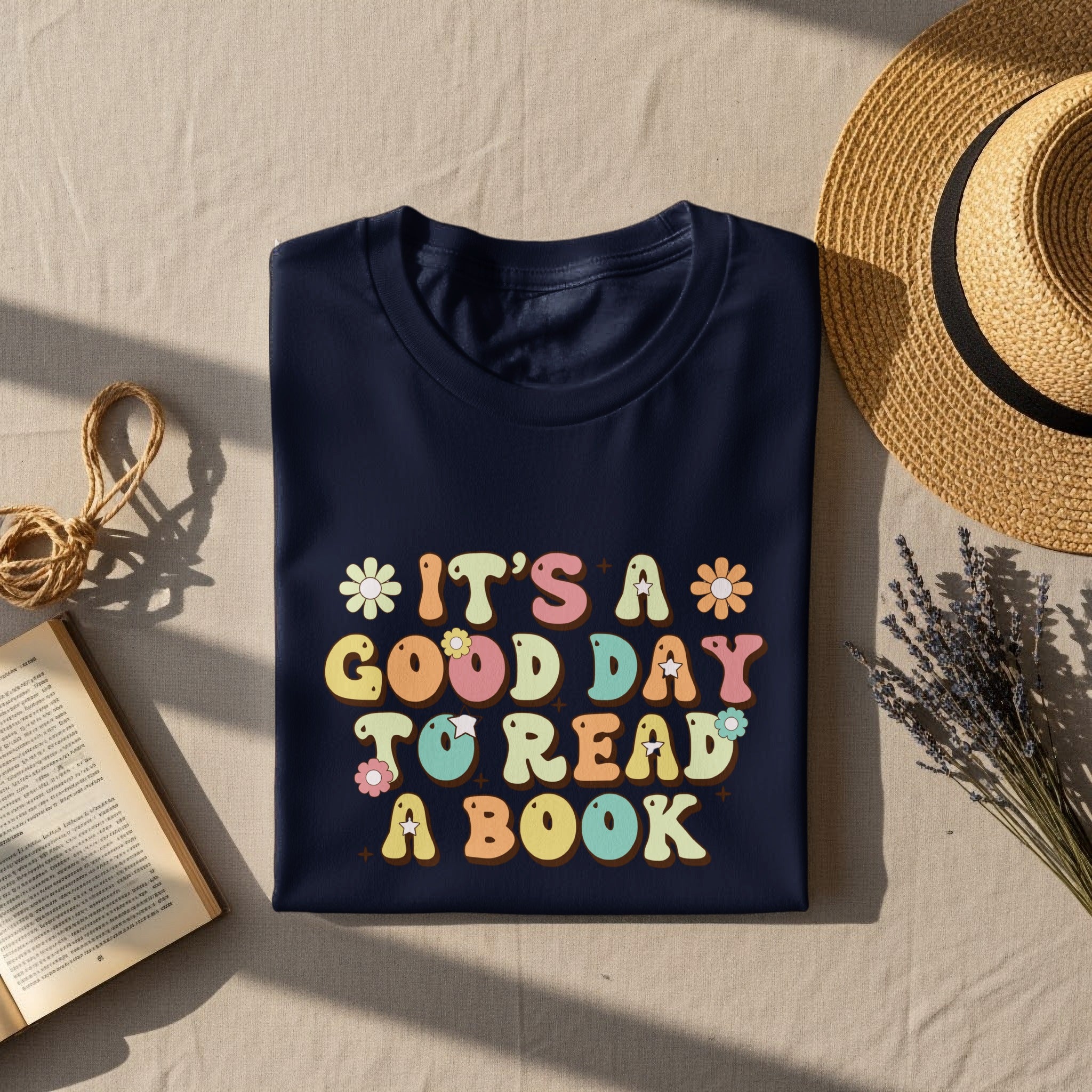 Navy t-shirt with "It's a good day to read a book" text and flowers.