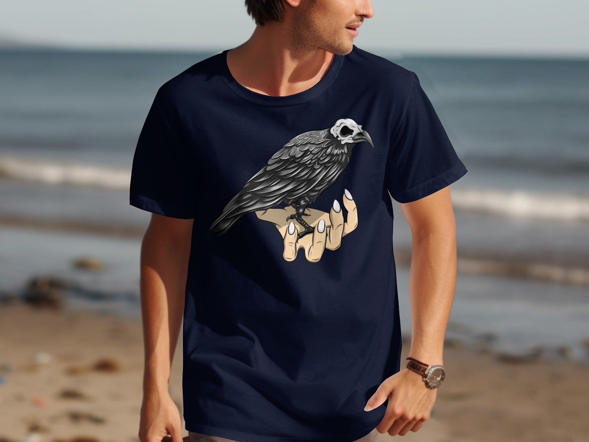 Dark blue t-shirt with a black bird with a skull head perched on a hand.