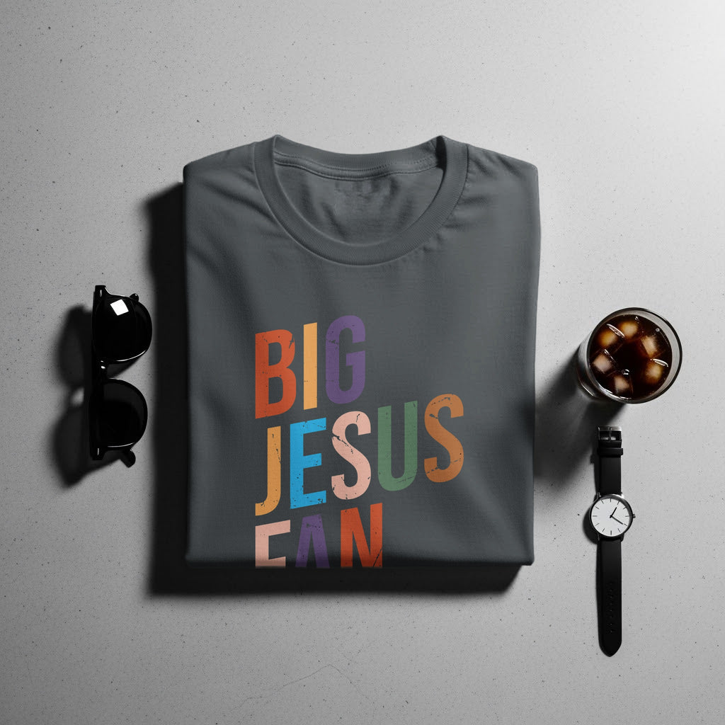 Dark grey t-shirt with "BIG JESUSCAN" text in colorful, distressed block letters.