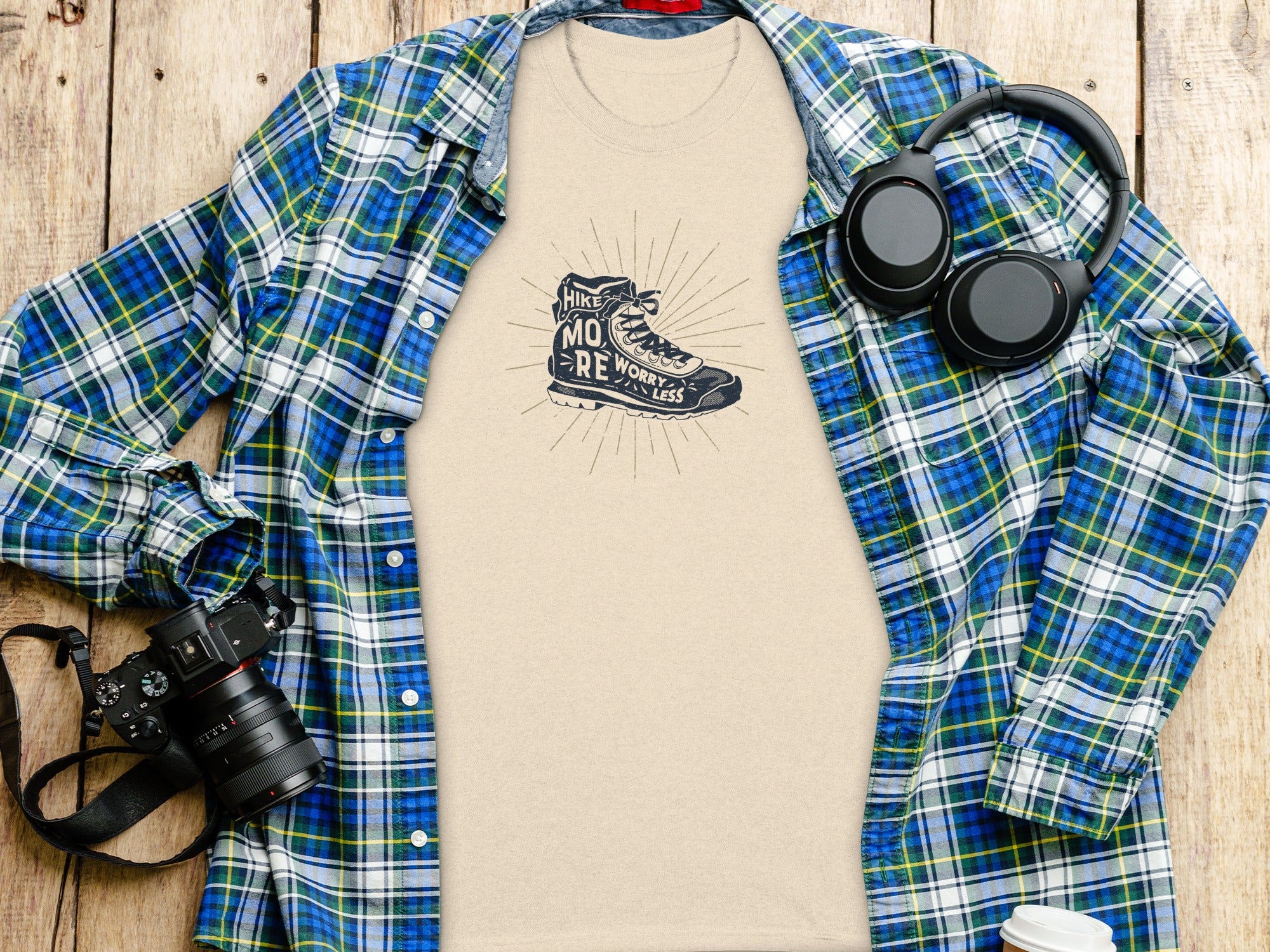 T-shirt with hiking boot graphic reading "Hike More, Worry Less."